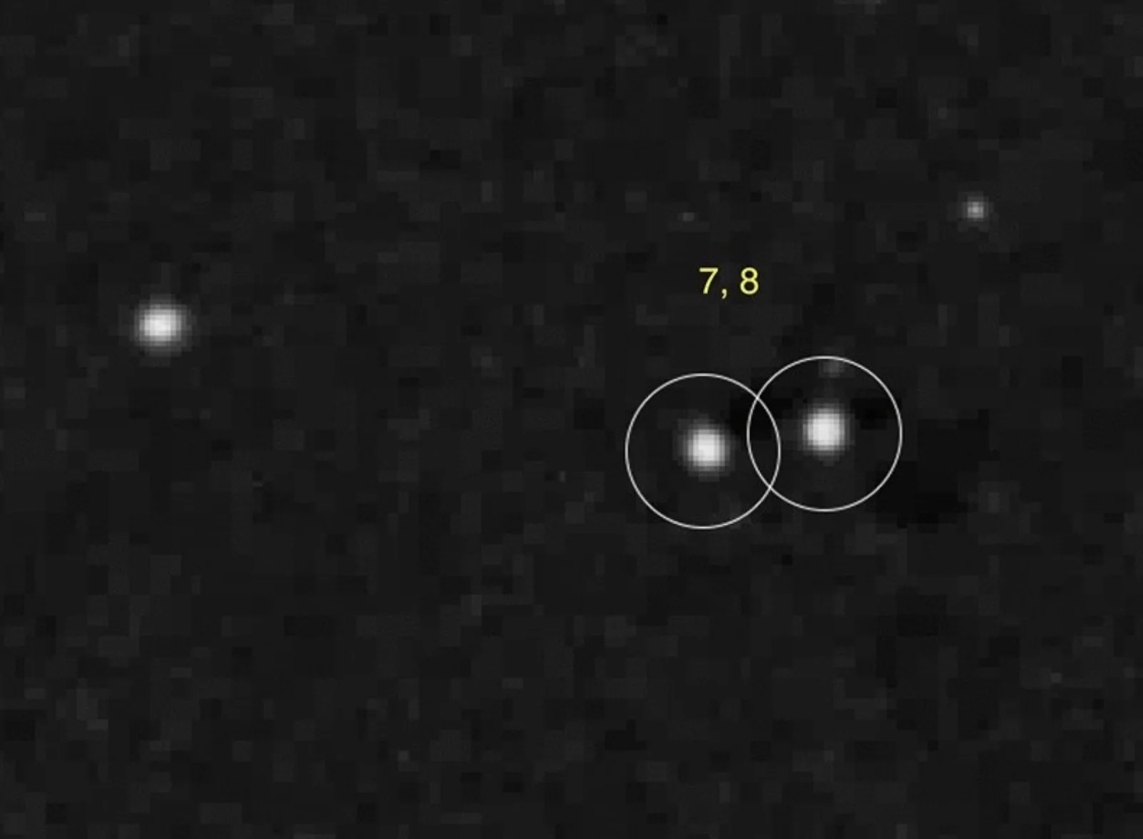 Plate cutout showing transients #7 and #8 — two overlapping white circles marking a paired flash on the dark sky field.